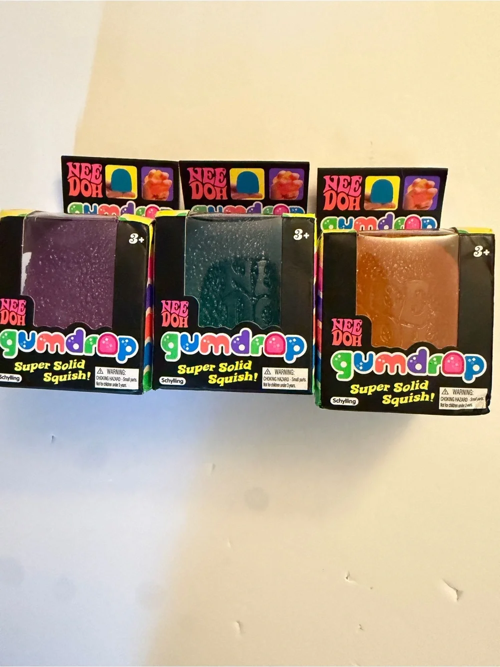 NeeDoh Gumdrop Super Solid Squish - Purple, blue and orange